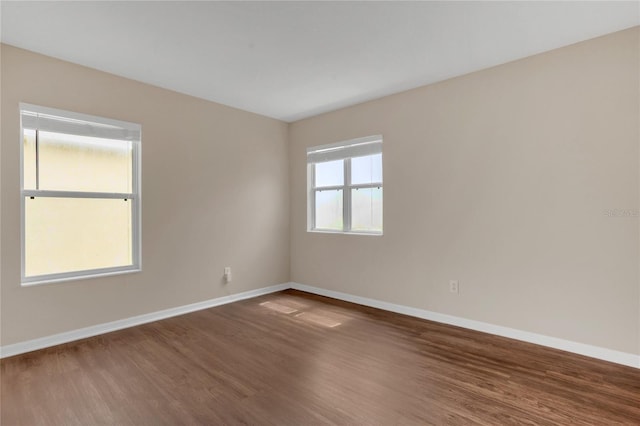 316 Crichton St, Ruskin, FL 33570 - unfurnished room featuring baseboards and wood finished floors