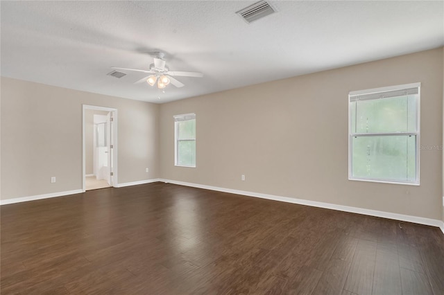 316 Crichton St, Ruskin, FL 33570 - empty room featuring a ceiling fan and dark wood-style flooring