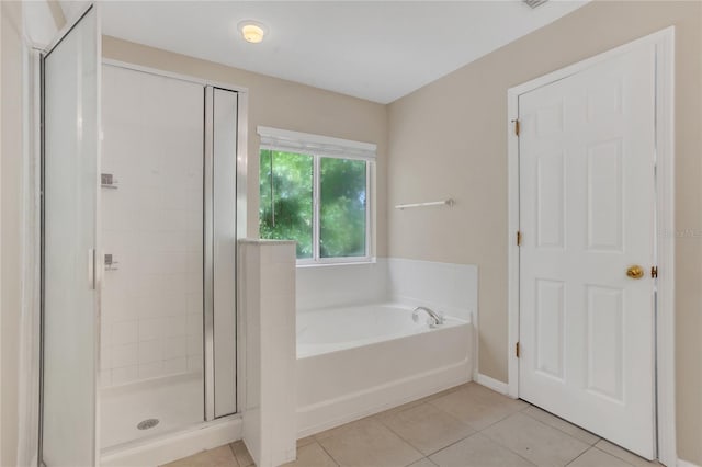 316 Crichton St, Ruskin, FL 33570 - full bathroom featuring tile patterned floors, a garden tub, and a shower stall