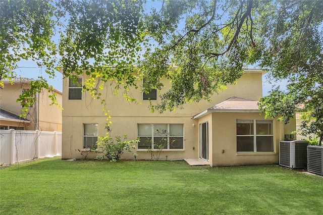 316 Crichton St, Ruskin, FL 33570 - rear view of property featuring stucco siding