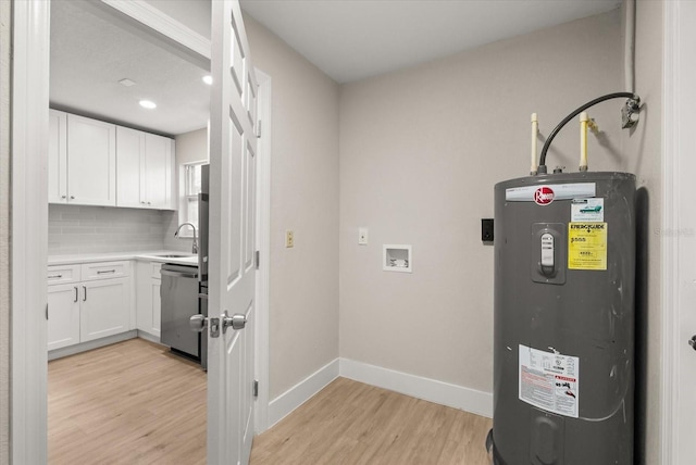 213 Flagler Ave, Edgewater, FL 32132 - washroom featuring water heater, cabinet space, light wood-type flooring, recessed lighting, and hookup for a washing machine