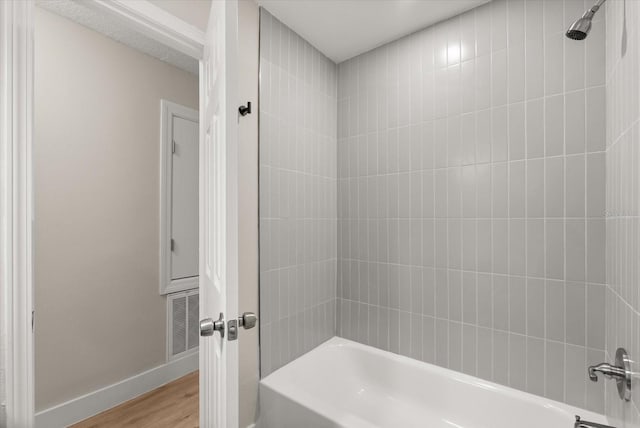 213 Flagler Ave, Edgewater, FL 32132 - bathroom featuring wood finished floors and shower / bathtub combination