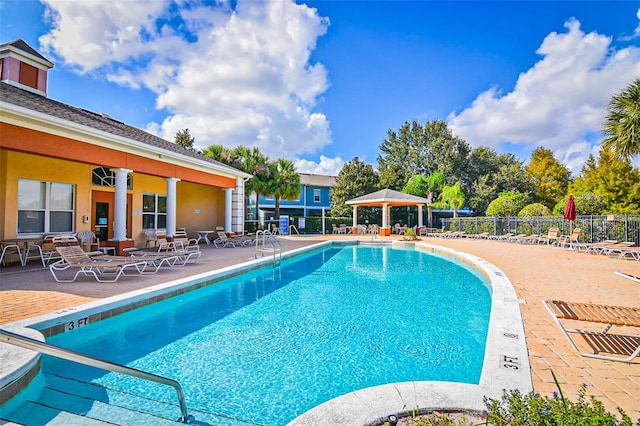 2426 Caravelle Cir, Kissimmee, FL 34746 - community pool featuring a patio