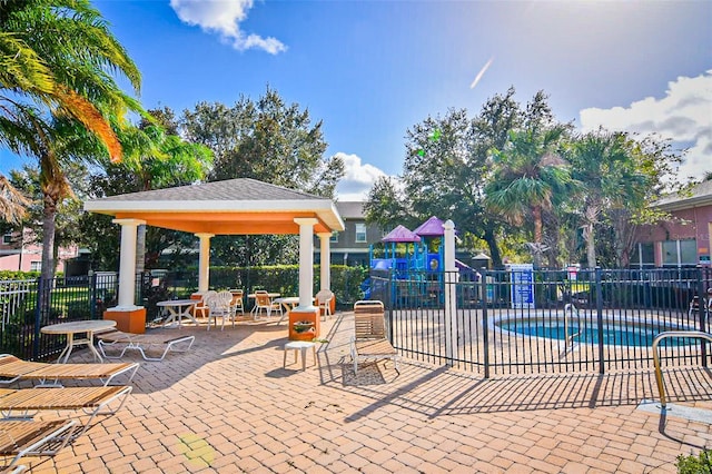 2426 Caravelle Cir, Kissimmee, FL 34746 - community pool featuring a gazebo and a patio area