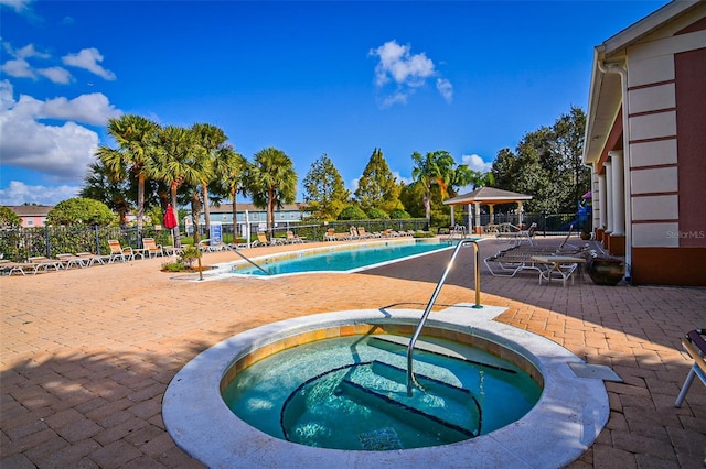 2426 Caravelle Cir, Kissimmee, FL 34746 - community pool featuring a hot tub, a patio, and a gazebo