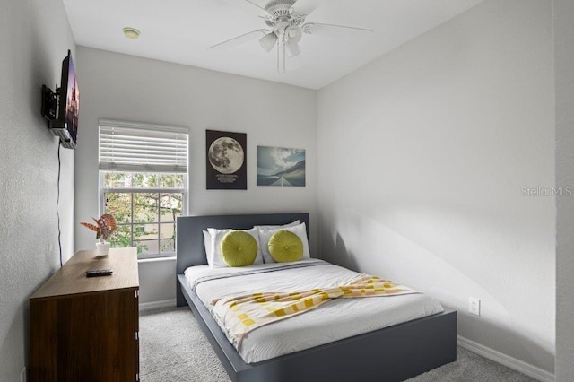 2426 Caravelle Cir, Kissimmee, FL 34746 - carpeted bedroom featuring baseboards and a ceiling fan
