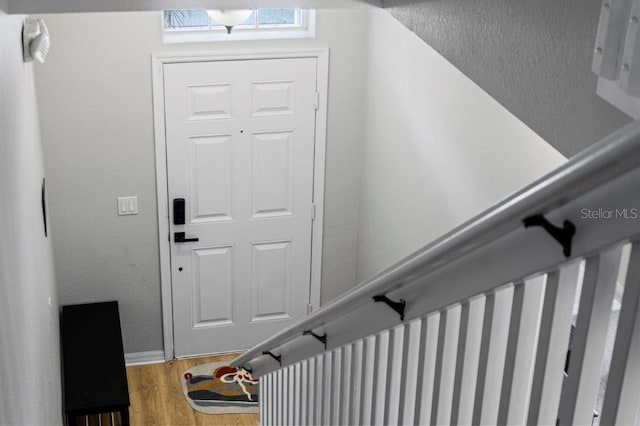 2426 Caravelle Cir, Kissimmee, FL 34746 - foyer entrance featuring wood finished floors and baseboards