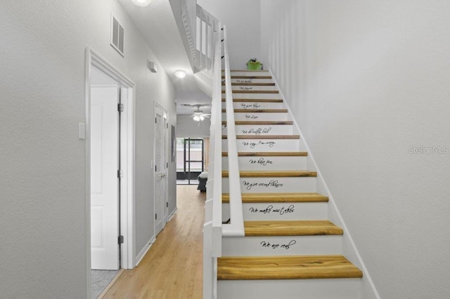 2426 Caravelle Cir, Kissimmee, FL 34746 - staircase with wood finished floors and a ceiling fan