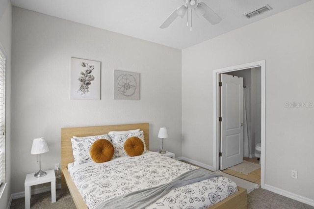 2426 Caravelle Cir, Kissimmee, FL 34746 - carpeted bedroom with baseboards and ensuite bath