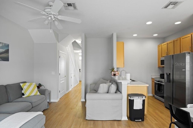 2426 Caravelle Cir, Kissimmee, FL 34746 - living room with recessed lighting, light wood-style floors, and ceiling fan
