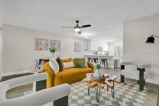 2318 Inagua Way, Winter Park, FL 32792 - living room with light wood finished floors, a ceiling fan, and recessed lighting
