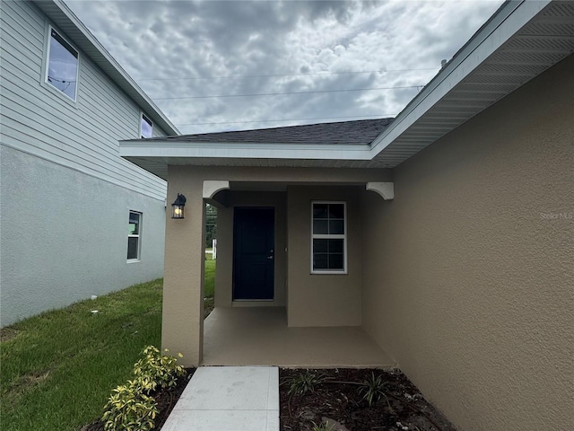 4038 Sagefield Dr, Harmony, FL 34773 - doorway to property featuring stucco siding