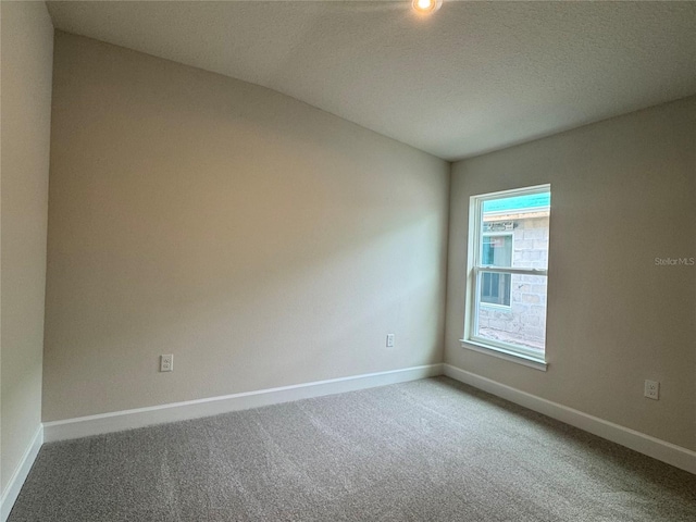 4038 Sagefield Dr, Harmony, FL 34773 - carpeted empty room featuring baseboards and a textured ceiling