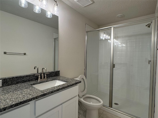 4038 Sagefield Dr, Harmony, FL 34773 - bathroom with a textured ceiling, vanity, a stall shower, and tile patterned flooring