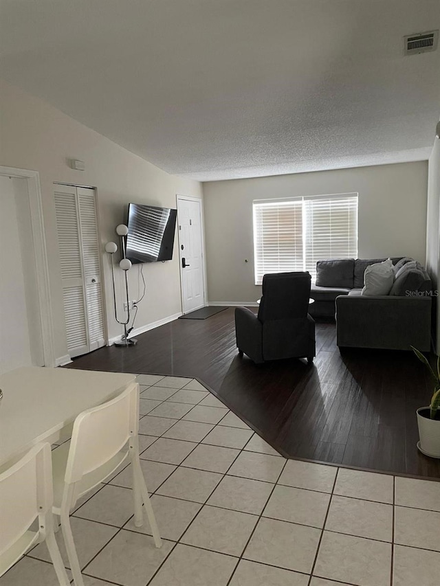 532 Koala Dr, Kissimmee, FL 34759 - living area with tile patterned floors and vaulted ceiling