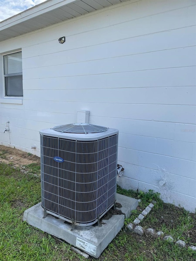 532 Koala Dr, Kissimmee, FL 34759 - exterior view of a central air condition unit and concrete block siding
