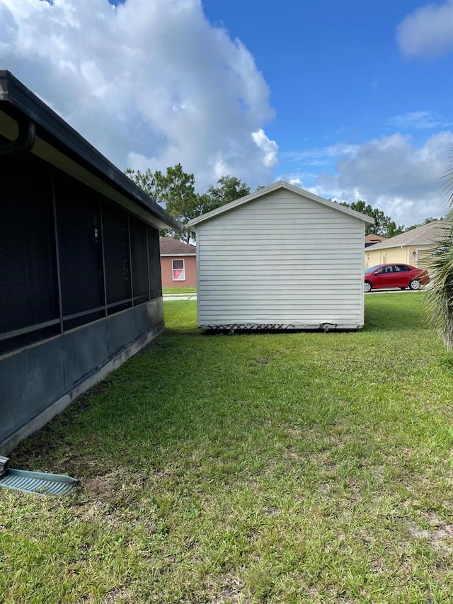 532 Koala Dr, Kissimmee, FL 34759 - view of grassy yard with a sunroom