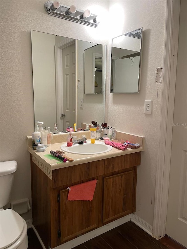 532 Koala Dr, Kissimmee, FL 34759 - half bathroom featuring vanity and wood finished floors