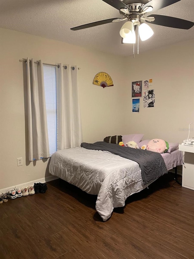 532 Koala Dr, Kissimmee, FL 34759 - bedroom featuring wood finished floors, a ceiling fan, and a textured ceiling
