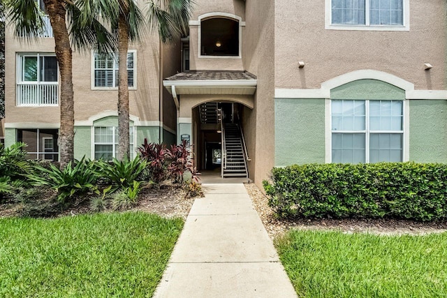 4881 Cypress Woods Dr Unit 3203, Orlando, FL 32811 - view of exterior entry featuring stucco siding