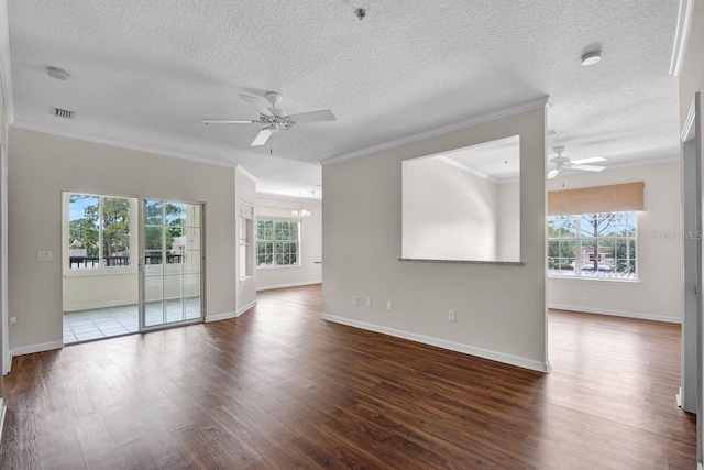 4881 Cypress Woods Dr Unit 3203, Orlando, FL 32811 - spare room featuring ceiling fan, dark wood-type flooring, a chandelier, crown molding, and a textured ceiling