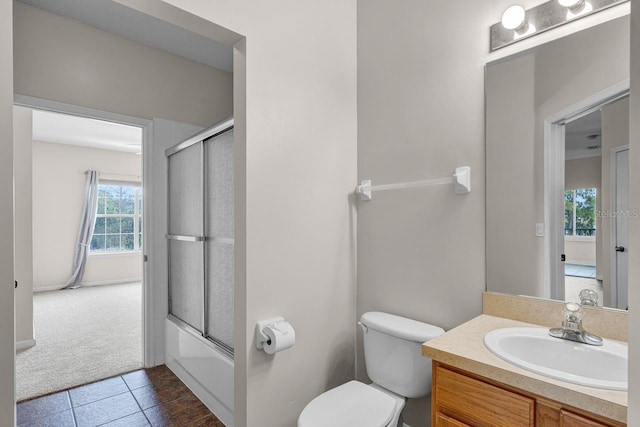 4881 Cypress Woods Dr Unit 3203, Orlando, FL 32811 - full bathroom featuring vanity, tile patterned floors, and bath / shower combo with glass door