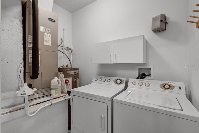 4881 Cypress Woods Dr Unit 3203, Orlando, FL 32811 - laundry room featuring cabinet space, washing machine and clothes dryer, and heating unit