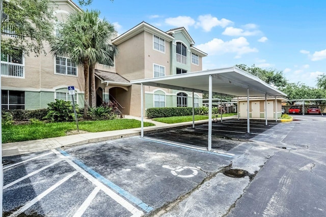 4881 Cypress Woods Dr Unit 3203, Orlando, FL 32811 - view of covered parking lot