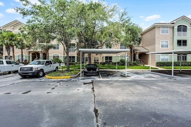 4881 Cypress Woods Dr Unit 3203, Orlando, FL 32811 - view of partially covered parking lot