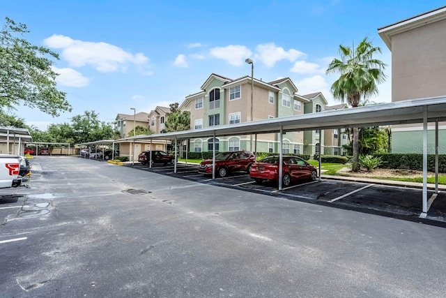 4881 Cypress Woods Dr Unit 3203, Orlando, FL 32811 - covered parking lot featuring a residential view