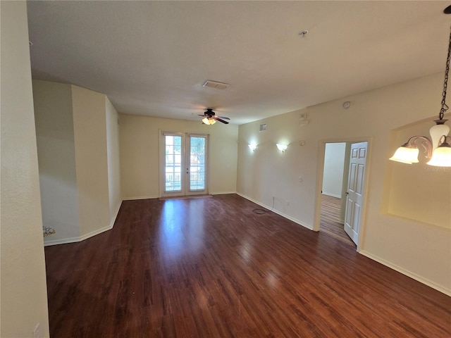 3001 Laurel Run Ln Unit 203, Kissimmee, FL 34741 - spare room with a chandelier, dark wood finished floors, a ceiling fan, and fire sprinkler in ceiling