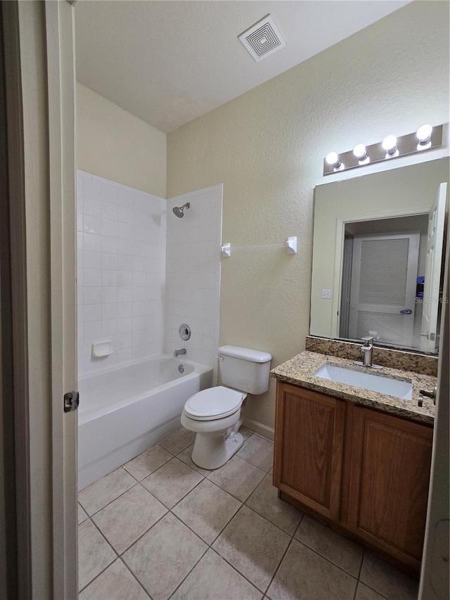 3001 Laurel Run Ln Unit 203, Kissimmee, FL 34741 - bathroom featuring tile patterned flooring, vanity, bathing tub / shower combination, and a textured wall
