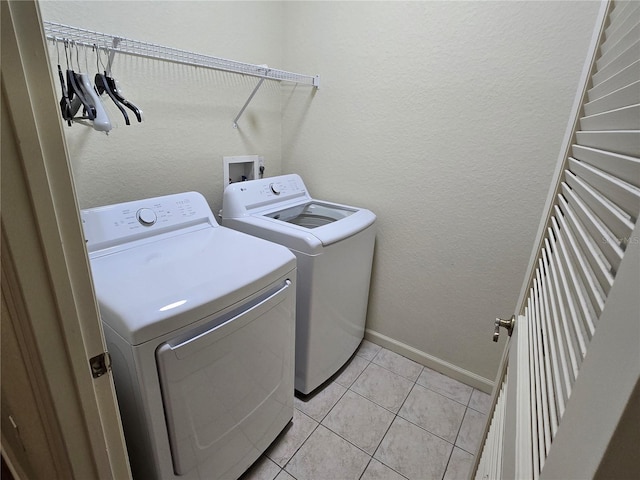 3001 Laurel Run Ln Unit 203, Kissimmee, FL 34741 - washroom featuring washer and clothes dryer and light tile patterned floors