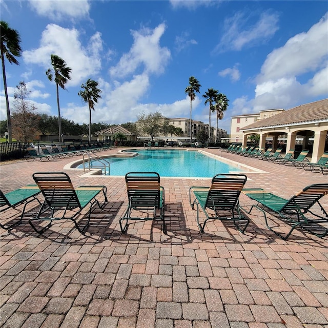 3001 Laurel Run Ln Unit 203, Kissimmee, FL 34741 - community pool featuring a patio area