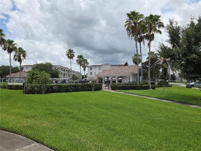 3001 Laurel Run Ln Unit 203, Kissimmee, FL 34741 - surrounding community with a lawn