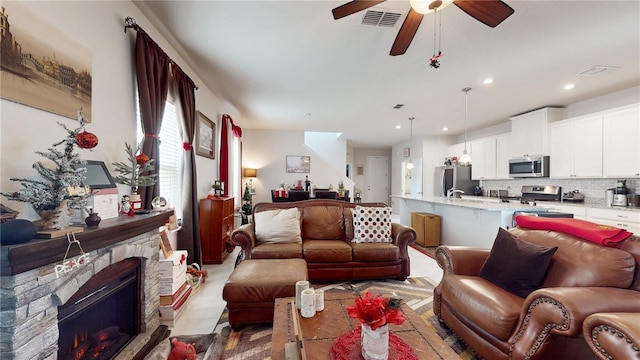 16250 Firedragon Dr, Winter Garden, FL 34787 - living room featuring a ceiling fan, recessed lighting, and a fireplace