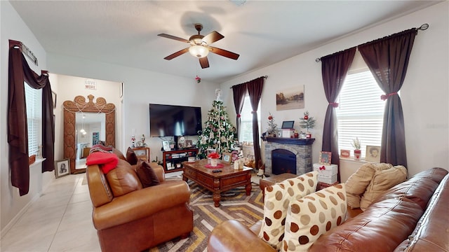 16250 Firedragon Dr, Winter Garden, FL 34787 - living area with a ceiling fan, light tile patterned floors, and a stone fireplace