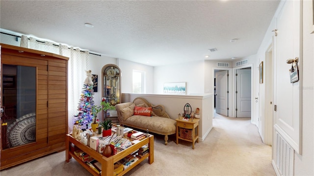 16250 Firedragon Dr, Winter Garden, FL 34787 - living room featuring light carpet, a textured ceiling, and recessed lighting