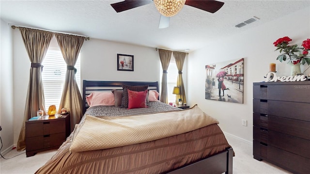 16250 Firedragon Dr, Winter Garden, FL 34787 - bedroom featuring light colored carpet, ceiling fan, and a textured ceiling