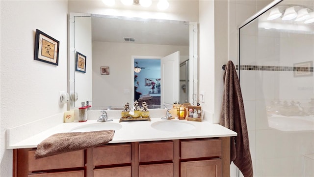 16250 Firedragon Dr, Winter Garden, FL 34787 - bathroom with double vanity, a shower with door, ensuite bathroom, and ceiling fan