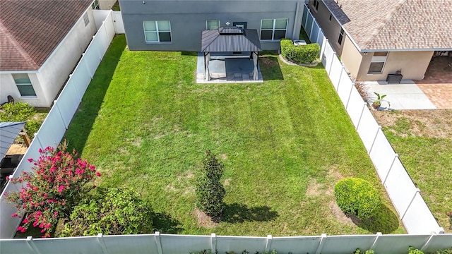 11127 Irish Moss Ave, Riverview, FL 33569 - fenced backyard featuring a patio area and a gazebo