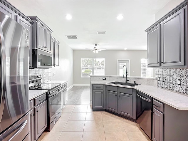11127 Irish Moss Ave, Riverview, FL 33569 - kitchen featuring stainless steel appliances, a peninsula, ceiling fan, gray cabinets, and recessed lighting