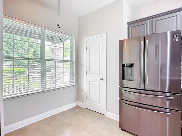 11127 Irish Moss Ave, Riverview, FL 33569 - kitchen with stainless steel fridge with ice dispenser and light tile patterned floors