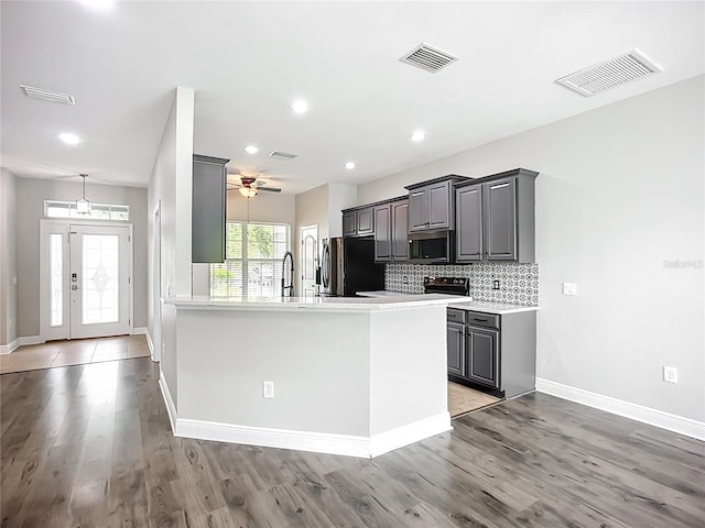 11127 Irish Moss Ave, Riverview, FL 33569 - kitchen with stainless steel microwave, smart refrigerator, gray cabinets, light wood-type flooring, and recessed lighting
