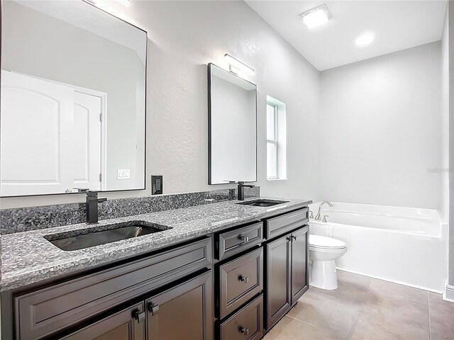 11127 Irish Moss Ave, Riverview, FL 33569 - bathroom with double vanity, a garden tub, and tile patterned flooring