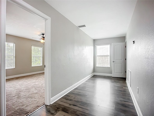 11127 Irish Moss Ave, Riverview, FL 33569 - unfurnished room featuring a ceiling fan, a textured wall, and dark wood-style floors