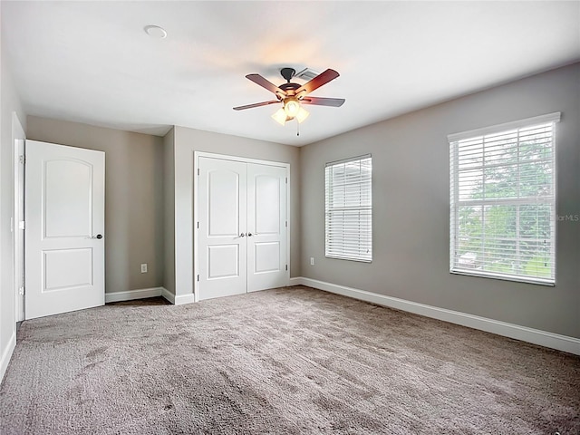 11127 Irish Moss Ave, Riverview, FL 33569 - unfurnished bedroom with a closet, carpet floors, and a ceiling fan