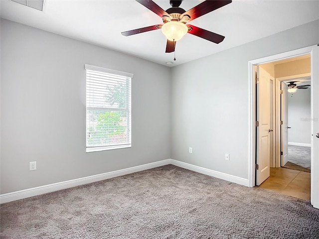 11127 Irish Moss Ave, Riverview, FL 33569 - spare room featuring light carpet and ceiling fan