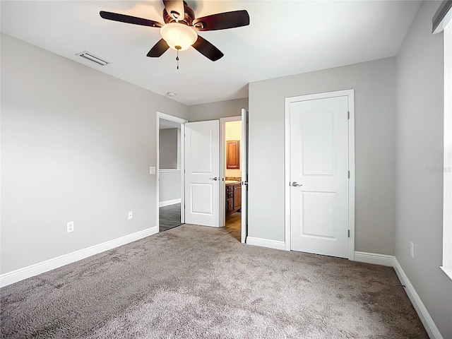 11127 Irish Moss Ave, Riverview, FL 33569 - unfurnished bedroom with carpet, ensuite bath, and a ceiling fan