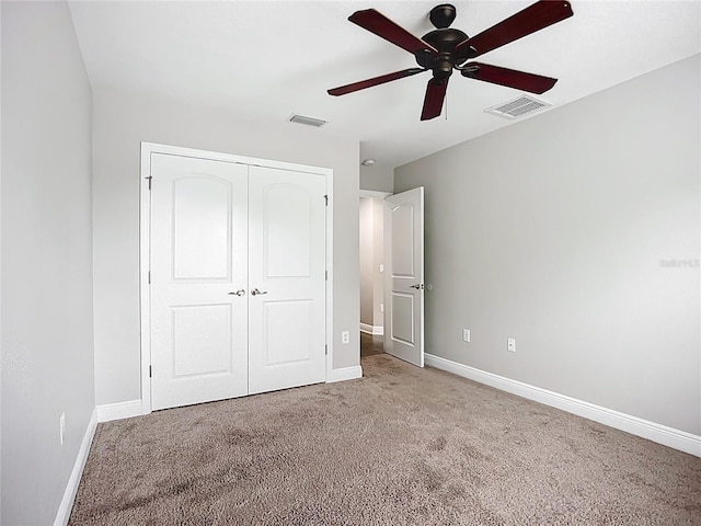 11127 Irish Moss Ave, Riverview, FL 33569 - unfurnished bedroom with light carpet, a closet, and a ceiling fan